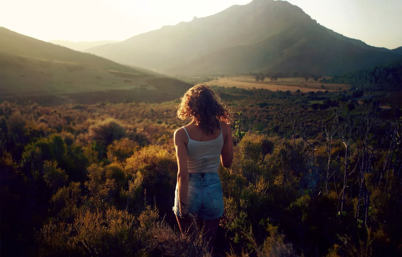 Photo wallpaper girl, grass, shorts, legs, nature, photo, photographer, mountains
