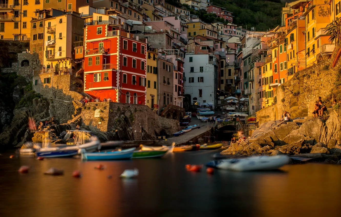 Photo wallpaper sea, light, sunset, the city, stones, shore, coast, boat