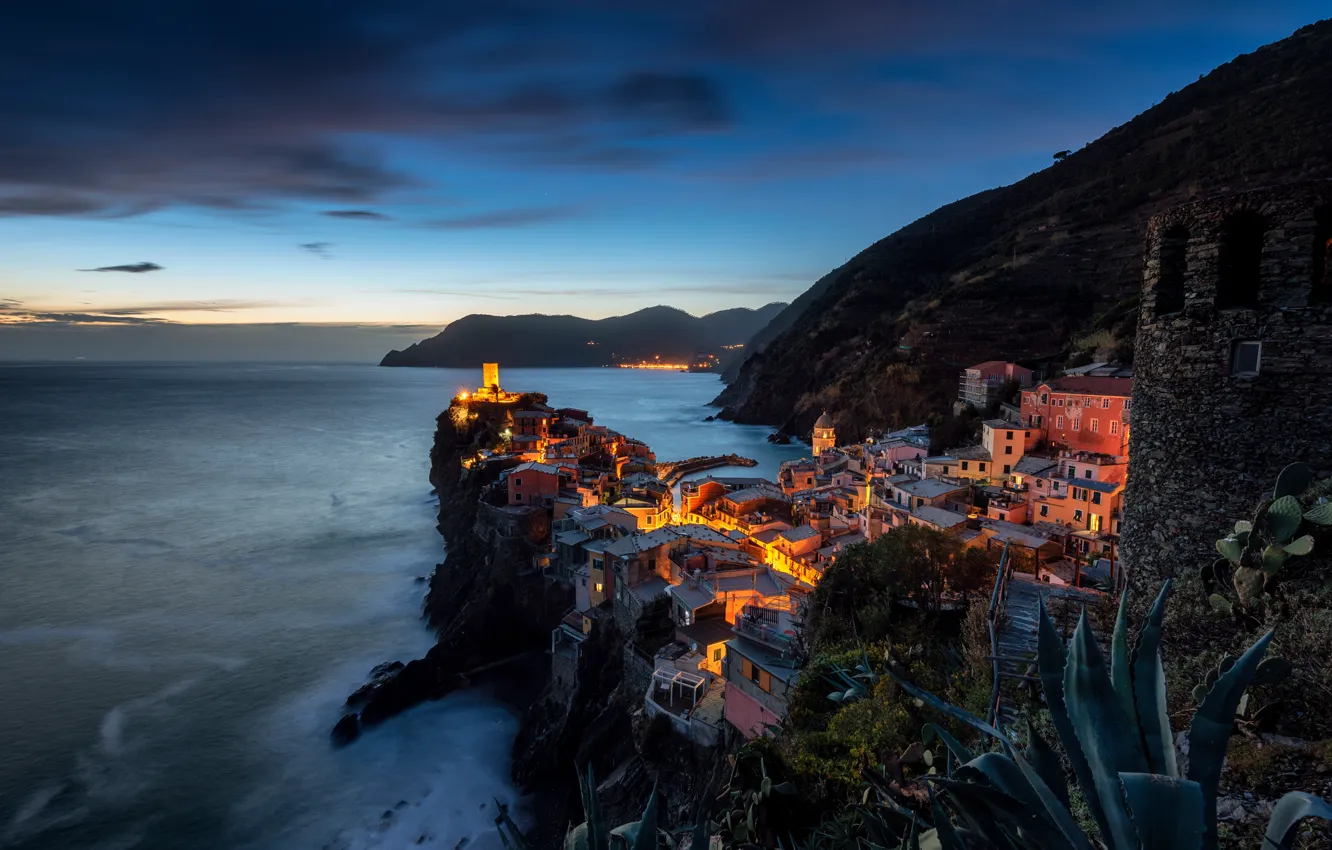 Photo wallpaper sea, the sky, clouds, mountains, night, the city, lights, rocks