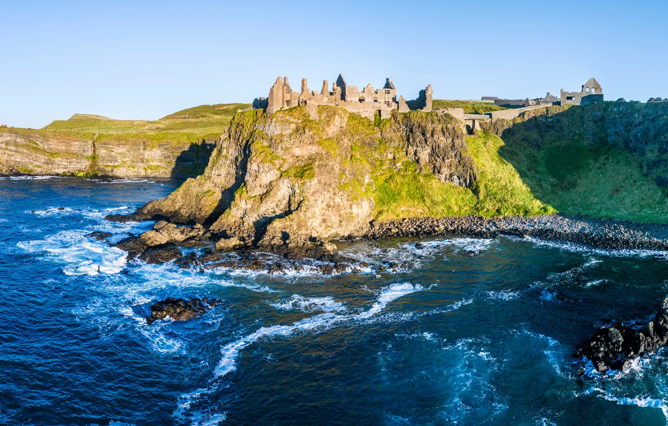 Photo wallpaper castle, rocks, coast, Northern Ireland