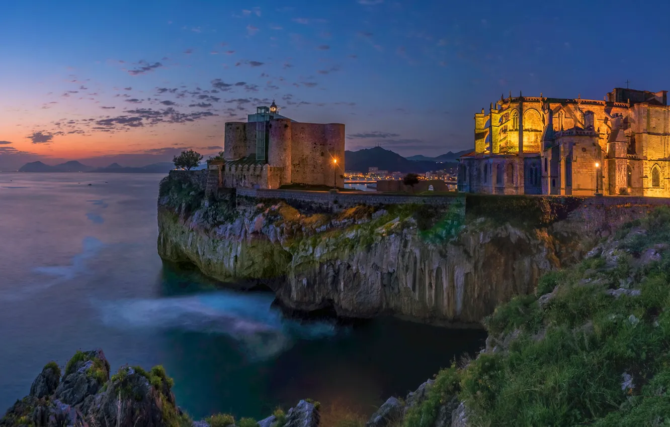 Photo wallpaper sea, sunset, lights, stones, rocks, coast, home, the evening