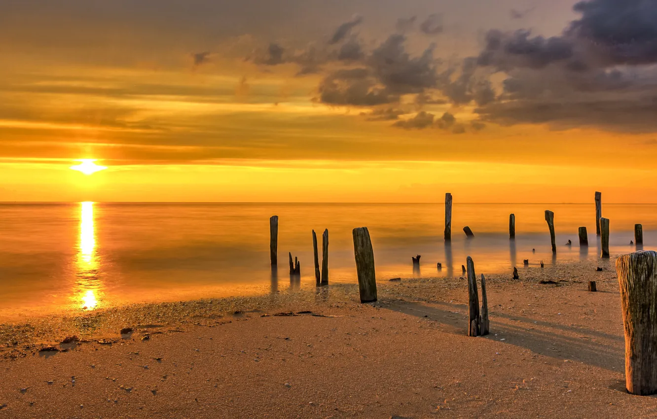 Photo wallpaper sea, the sky, the sun, shore, piles