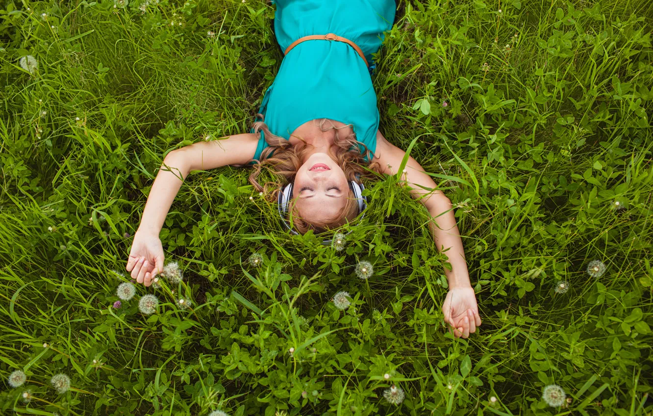 Photo wallpaper grass, girl, smile, dandelion, headphones, blonde, clover, curls