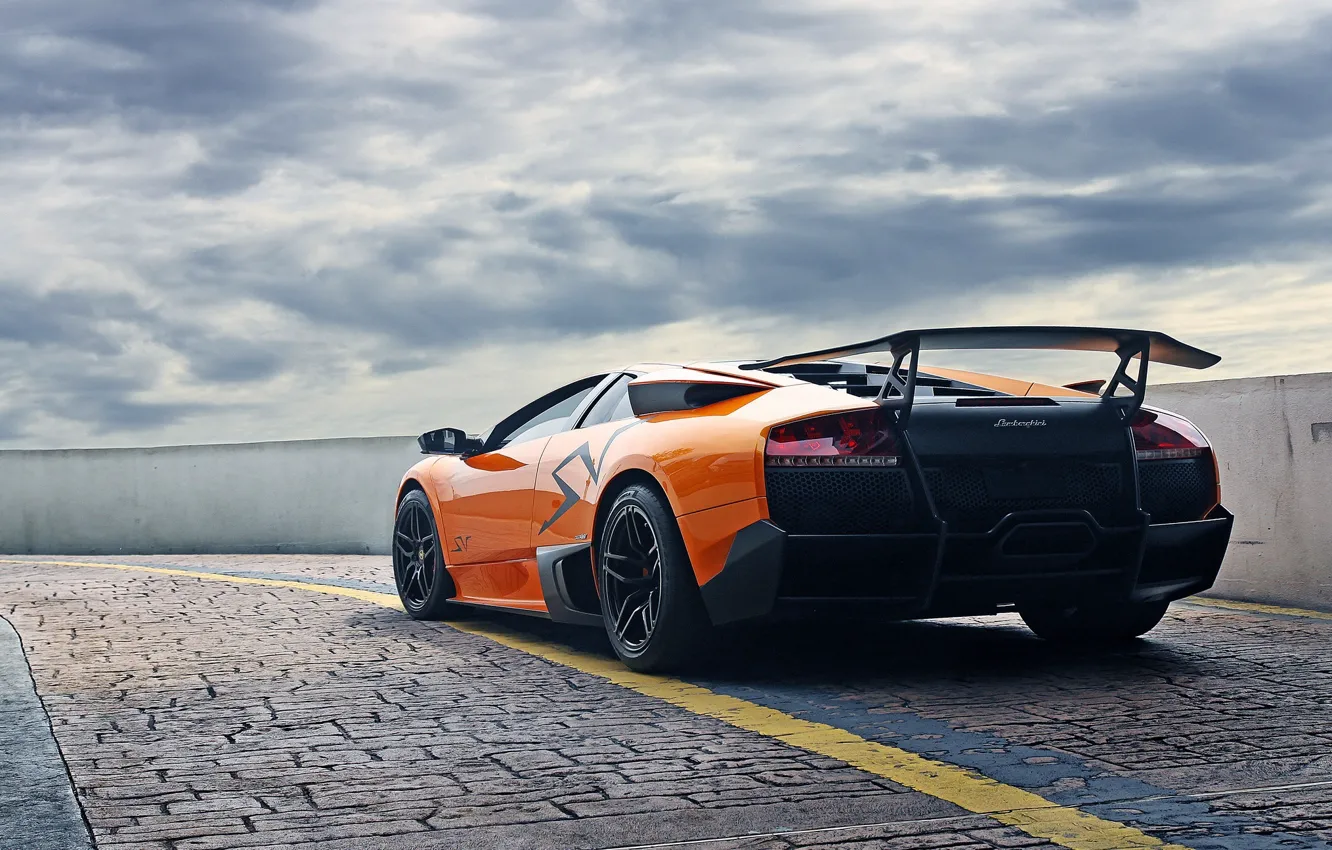 Photo wallpaper the sky, orange, clouds, pavers, the fence, lamborghini, murcielago, orange