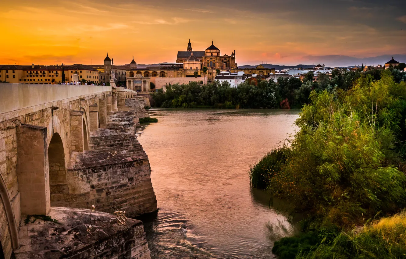 Photo wallpaper sunset, bridge, the city, river, building, home, Church, Spain