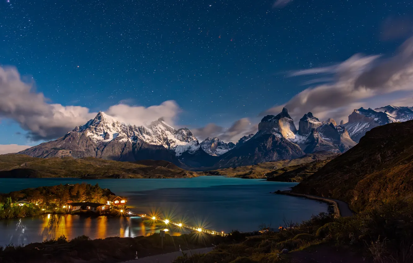 Photo wallpaper clouds, mountains, night, bridge, lights, shore, home, house