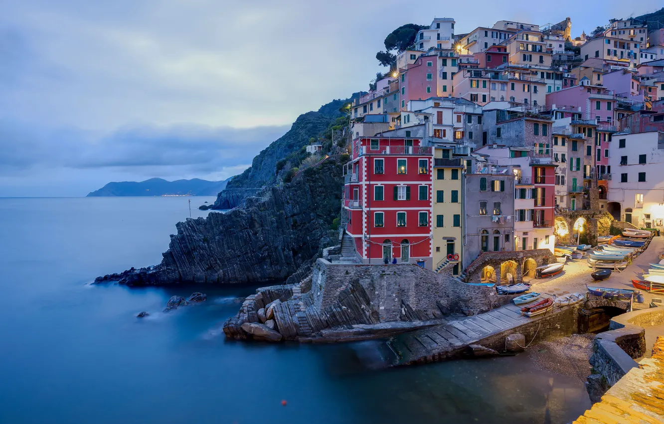 Photo wallpaper sea, clouds, mountains, the city, lights, rocks, shore, boat