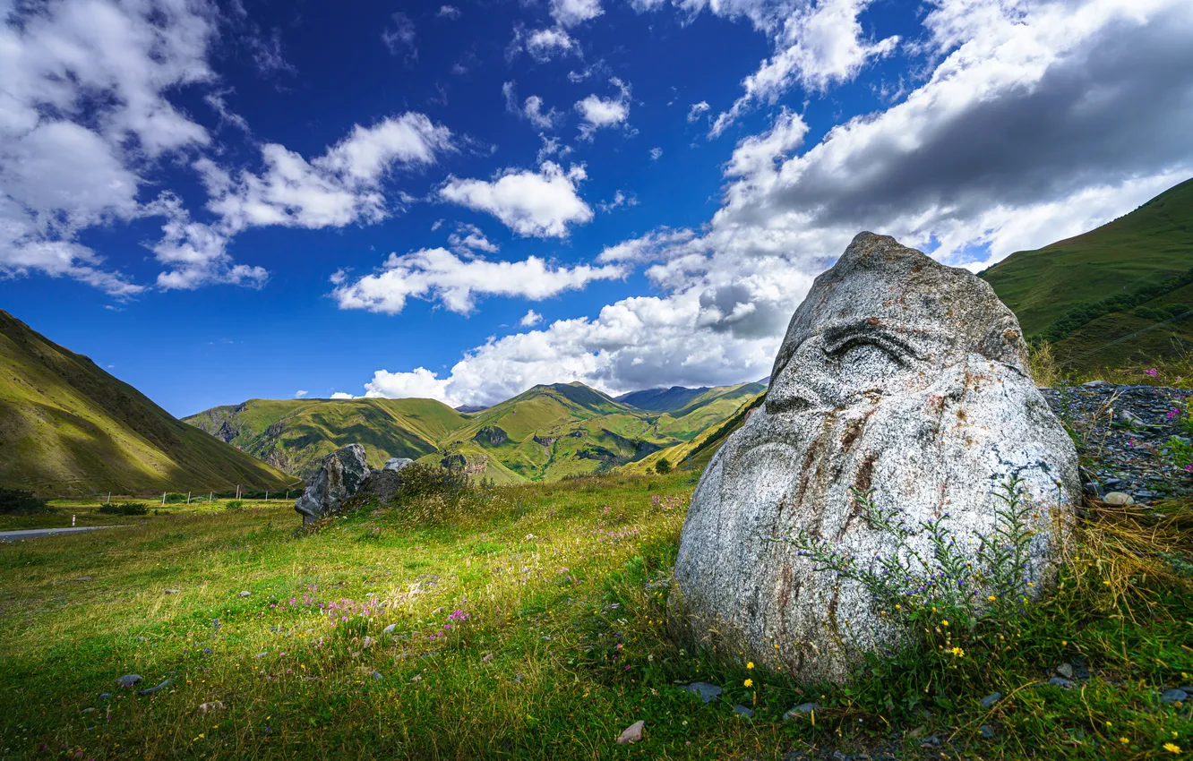 Photo wallpaper field, look, clouds, face, blue, hills, stone, male
