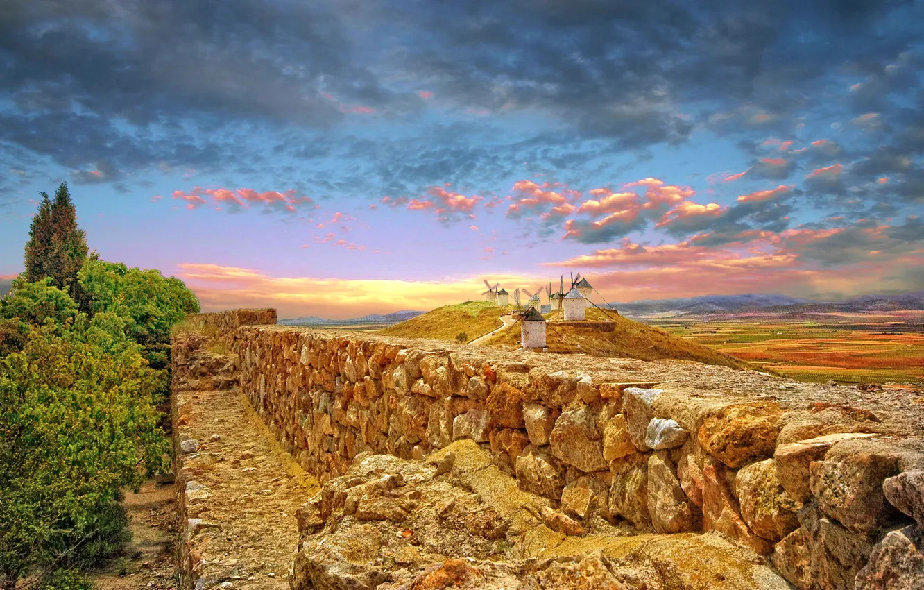 Photo wallpaper the sky, clouds, mountains, hills, the fence, Spain, windmill