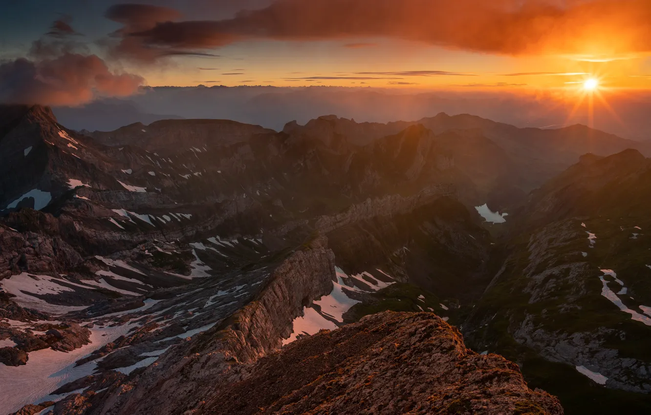 Photo wallpaper the sky, the sun, rays, snow, sunset, mountains, clouds, rocks
