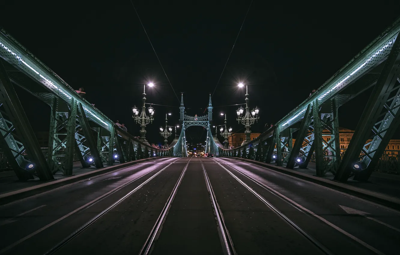 Photo wallpaper city, lights, road, bridge, glare, people, rails, asphalt