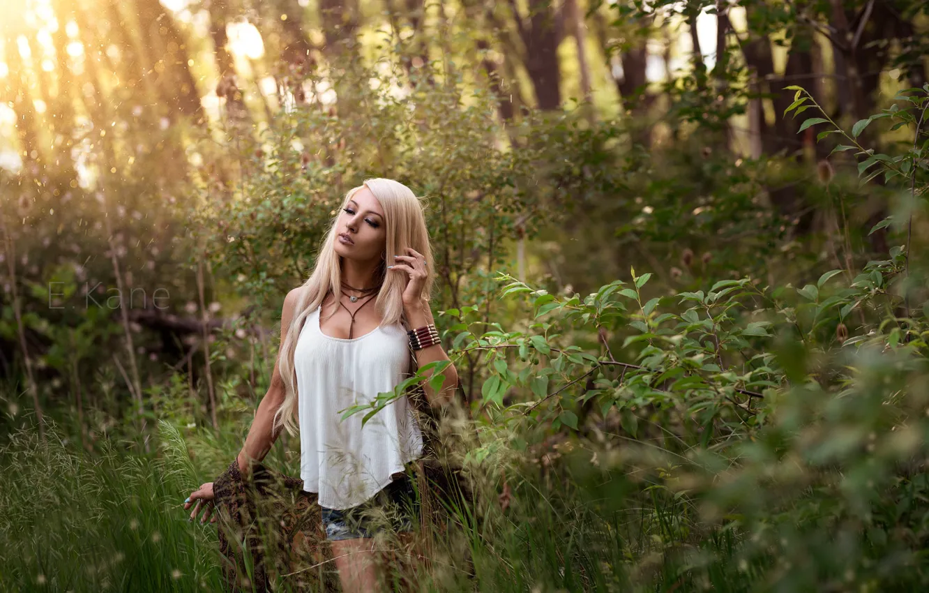 Photo wallpaper grass, the sun, trees, branches, pose, model, shorts, portrait