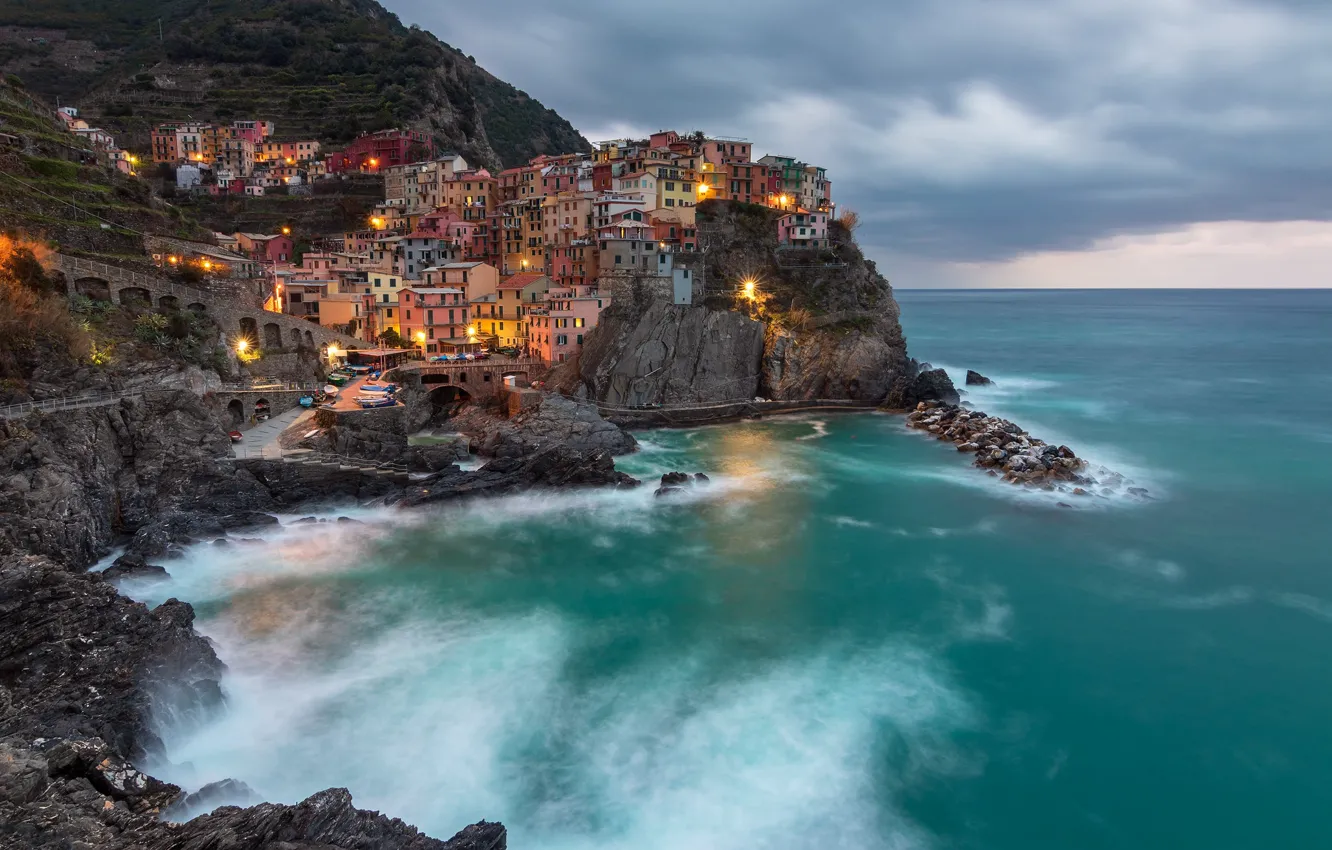 Photo wallpaper sea, clouds, the city, lights, rocks, shore, building, home