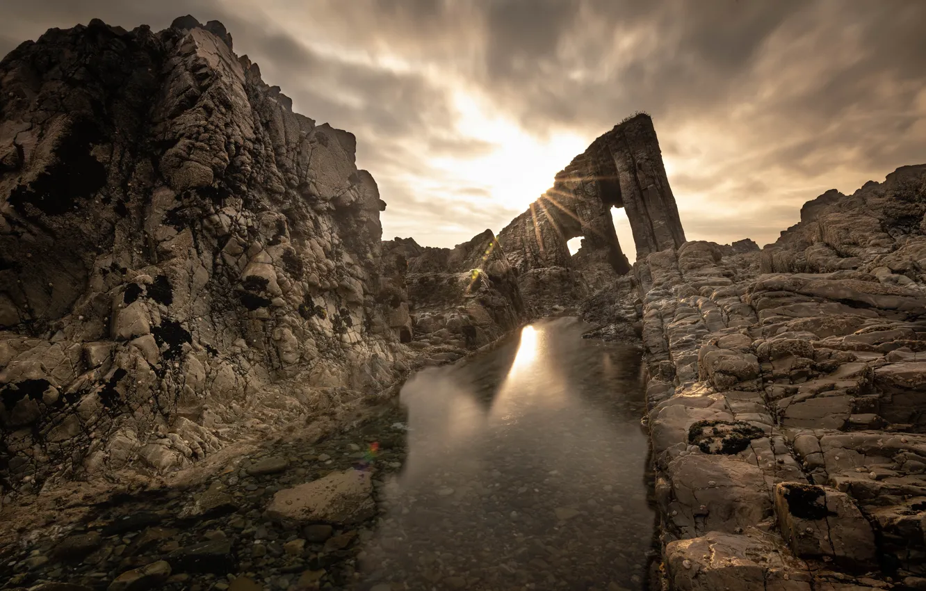 Photo wallpaper sea, the sky, clouds, rays, light, rock, stones, rocks