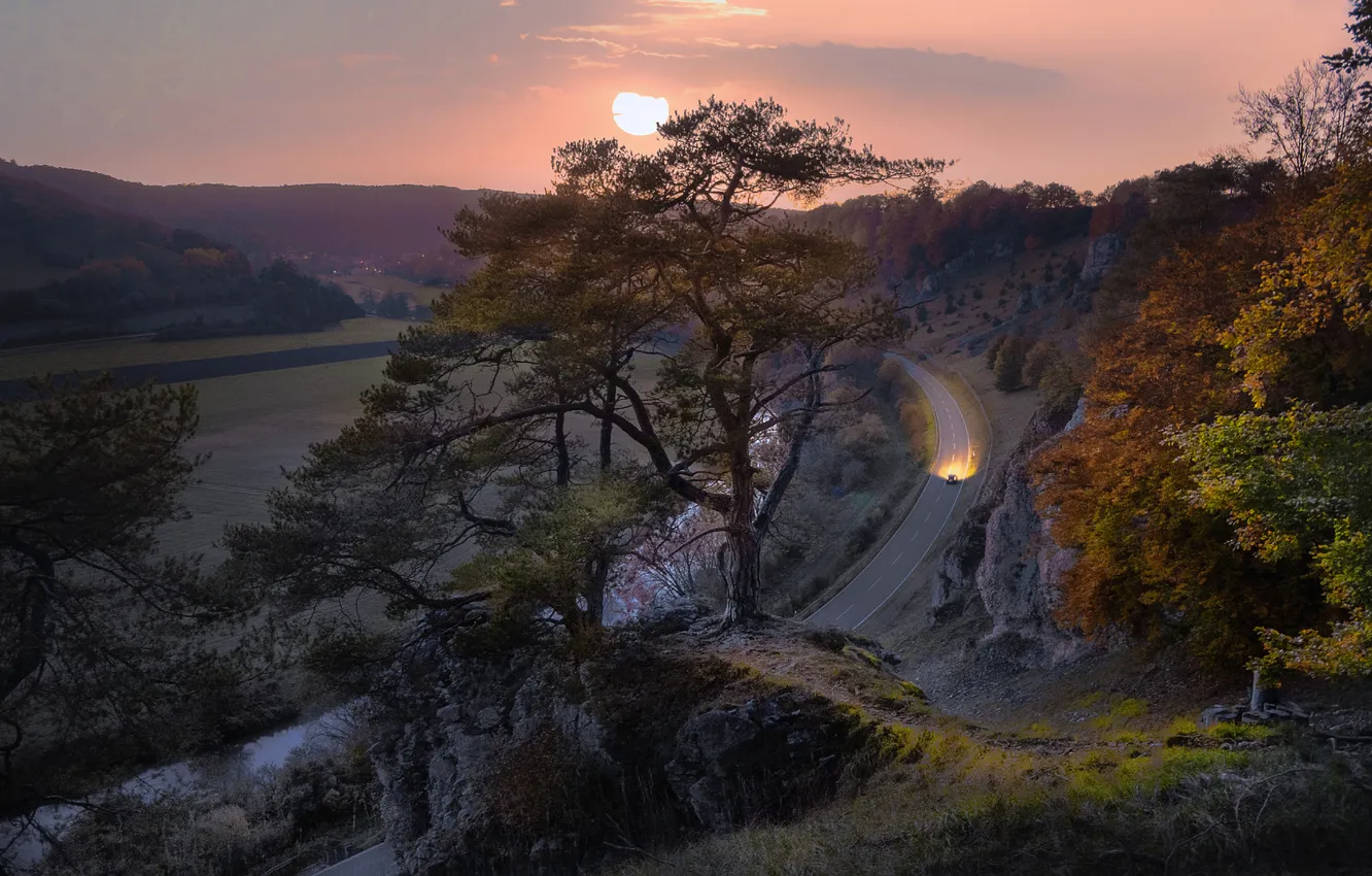 Photo wallpaper road, field, autumn, the sky, the sun, trees, sunset, mountains