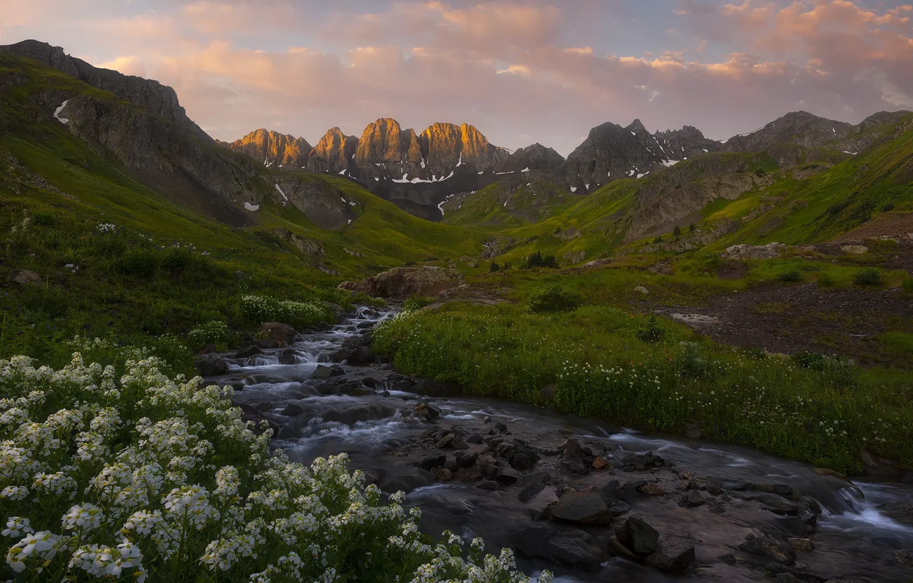 Photo wallpaper summer, clouds, flowers, mountains, stream, stones, shore, the slopes
