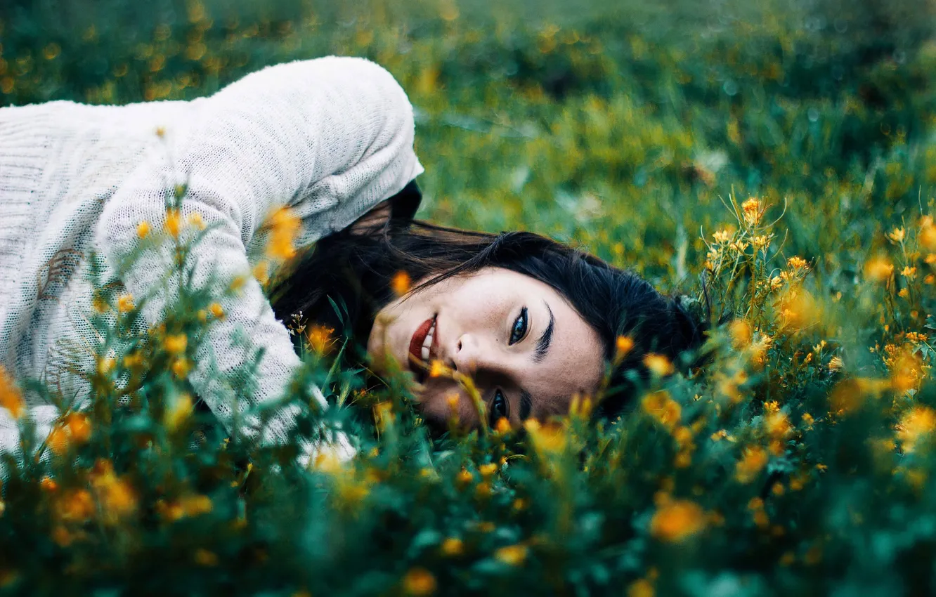 Photo wallpaper grass, eyes, girl, flowers, hair, lips, sweater, lying