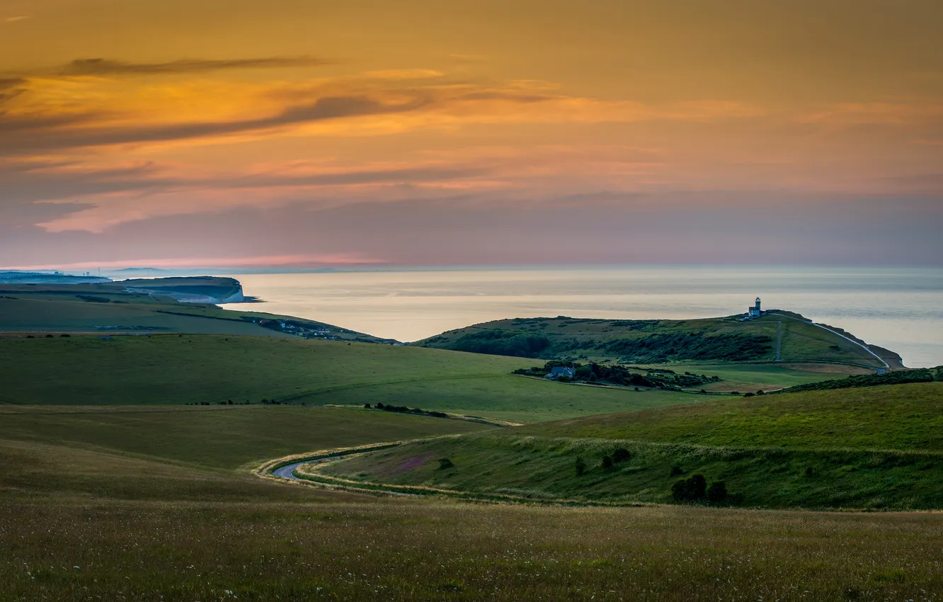 Photo wallpaper road, sea, field, the sky, clouds, sunset, hills, shore