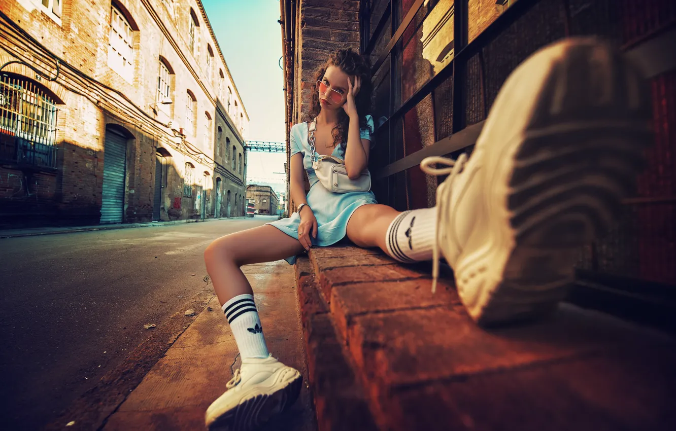 Photo wallpaper girl, face, the city, glasses, sitting, sneakers