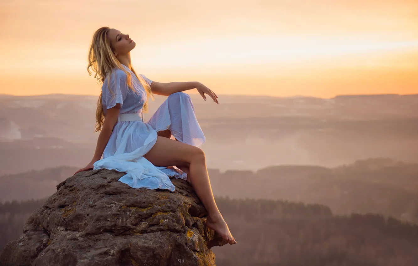 Photo wallpaper girl, landscape, sunset, stones, view, height, dal, legs