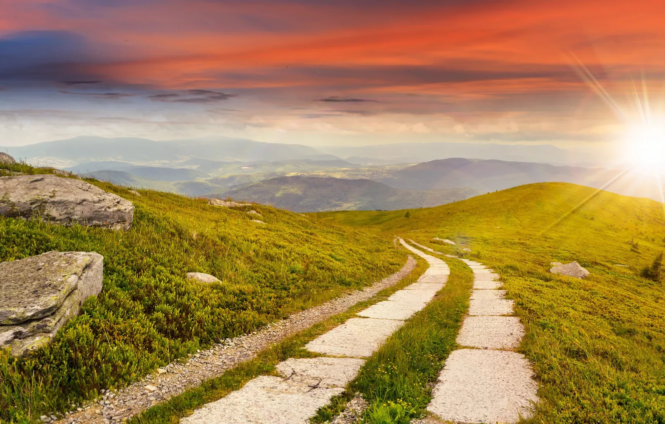 Photo wallpaper road, greens, field, the sky, grass, the sun, rays, mountains