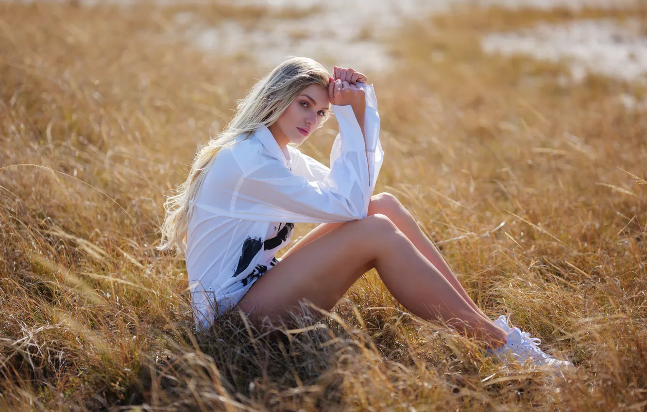 Photo wallpaper grass, look, girl, pose, feet, blonde, blouse, long hair