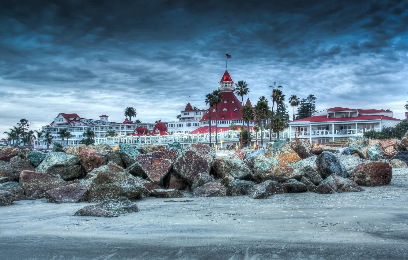 Photo wallpaper the sky, clouds, clouds, stones, palm trees, coast, USA, the hotel