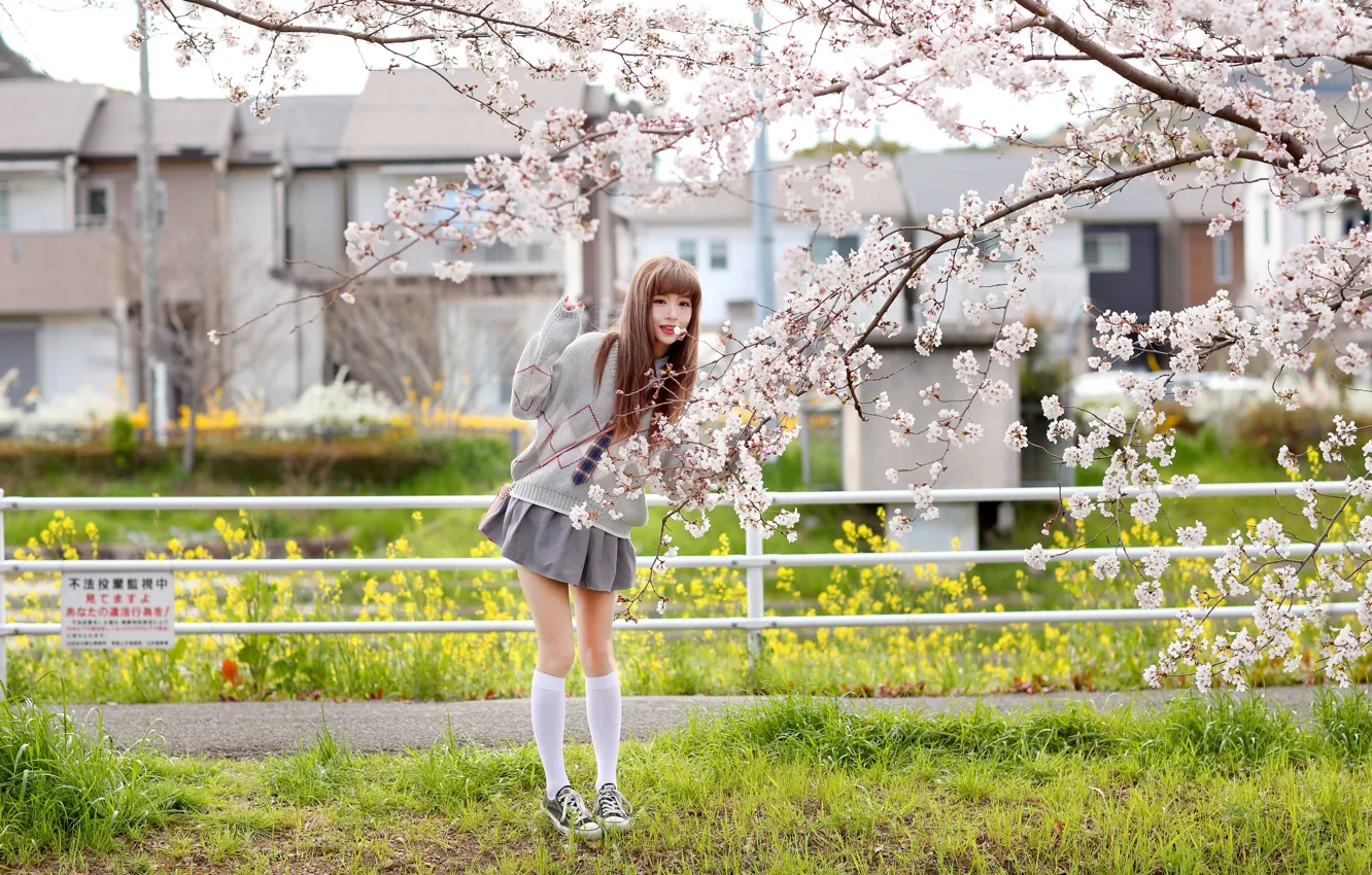 Photo wallpaper grass, look, trees, flowers, branches, model, sneakers, skirt