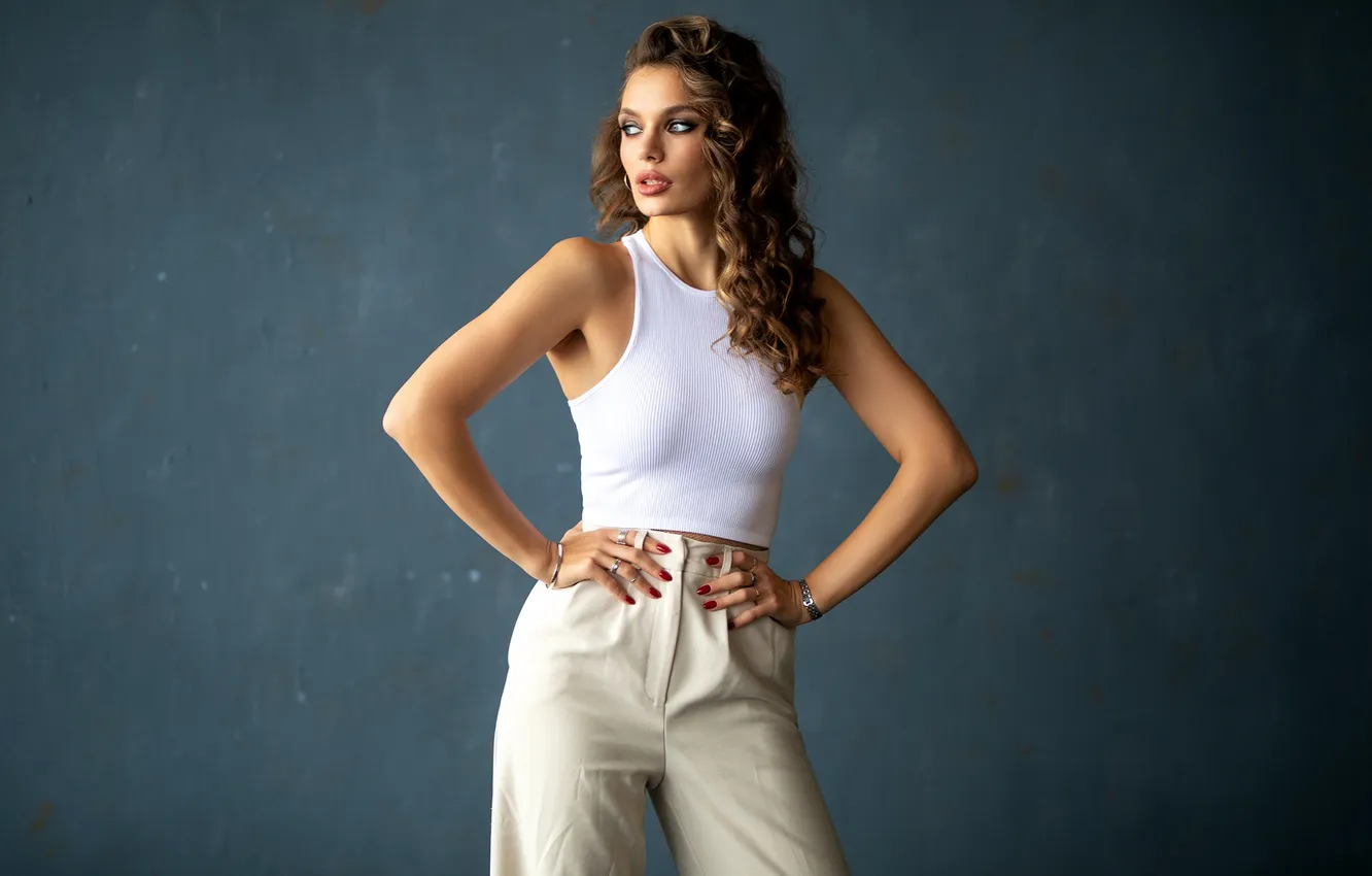 Photo wallpaper girl, pose, background, hands, figure, long hair, curls, pants