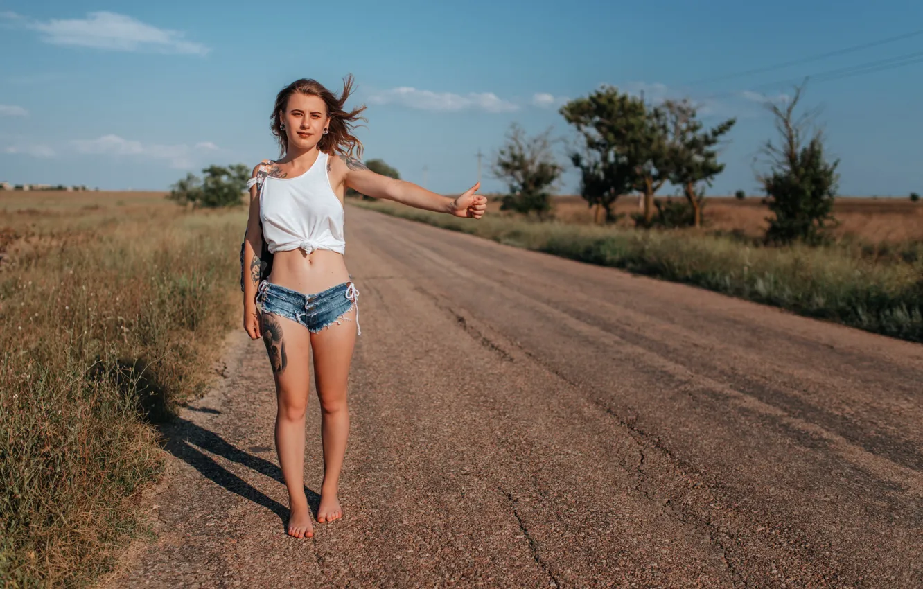 Photo wallpaper girl, road, shorts, long hair, legs, trees, field, photo