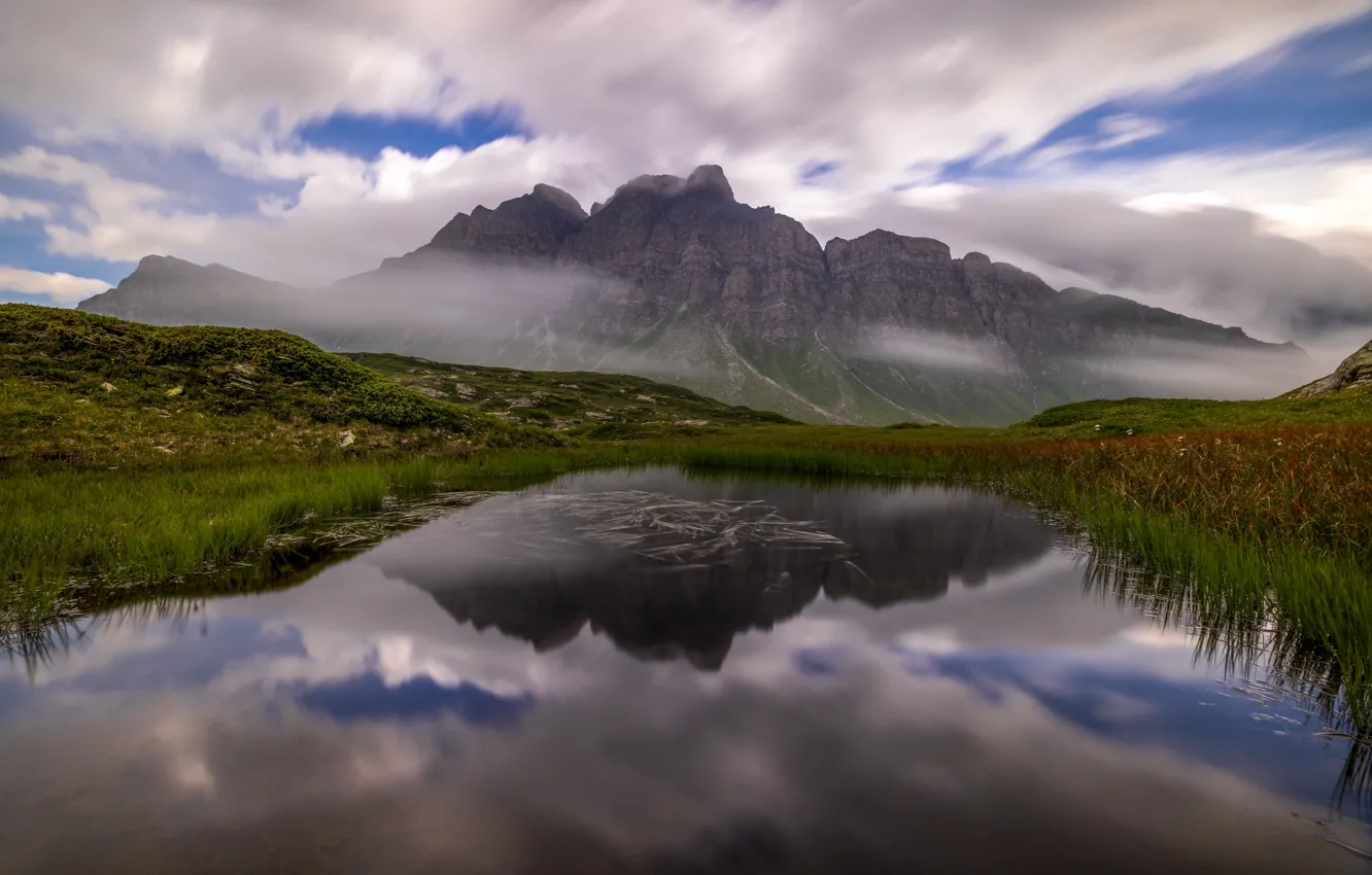 Photo wallpaper grass, clouds, mountains, fog, lake, reflection, shore