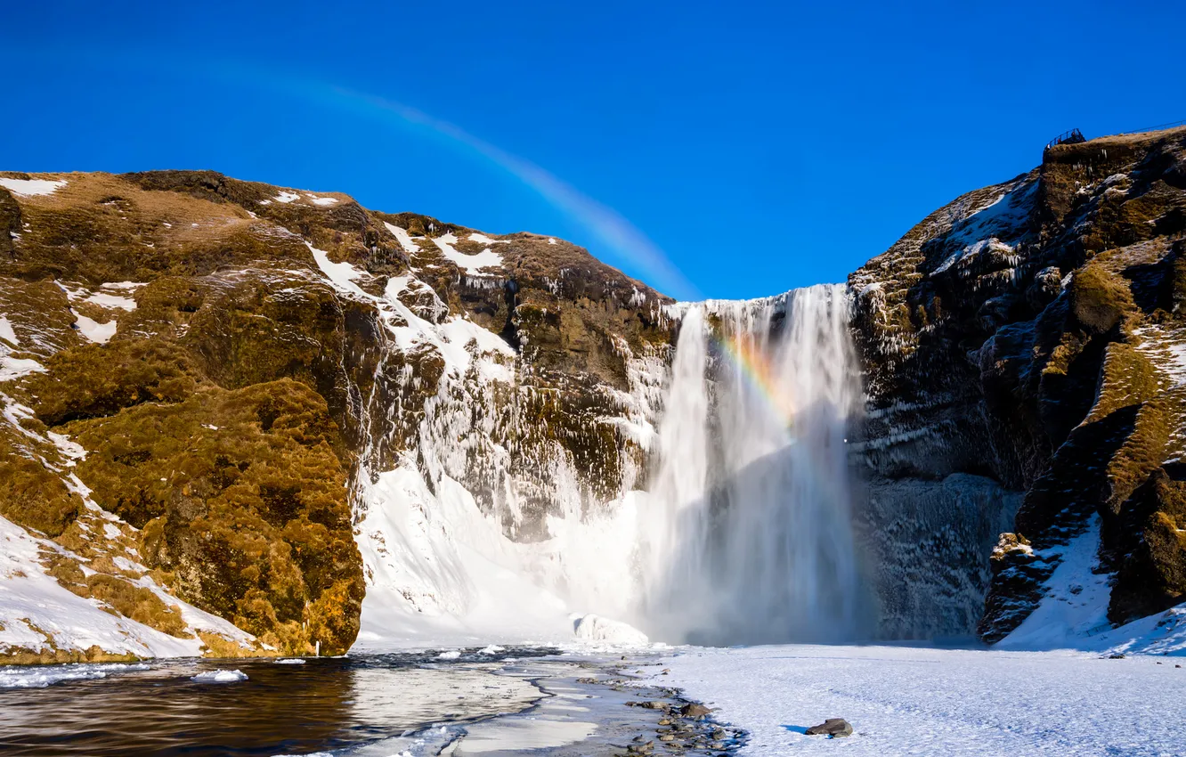 Photo wallpaper winter, snow, mountains, rocks, waterfall, rainbow