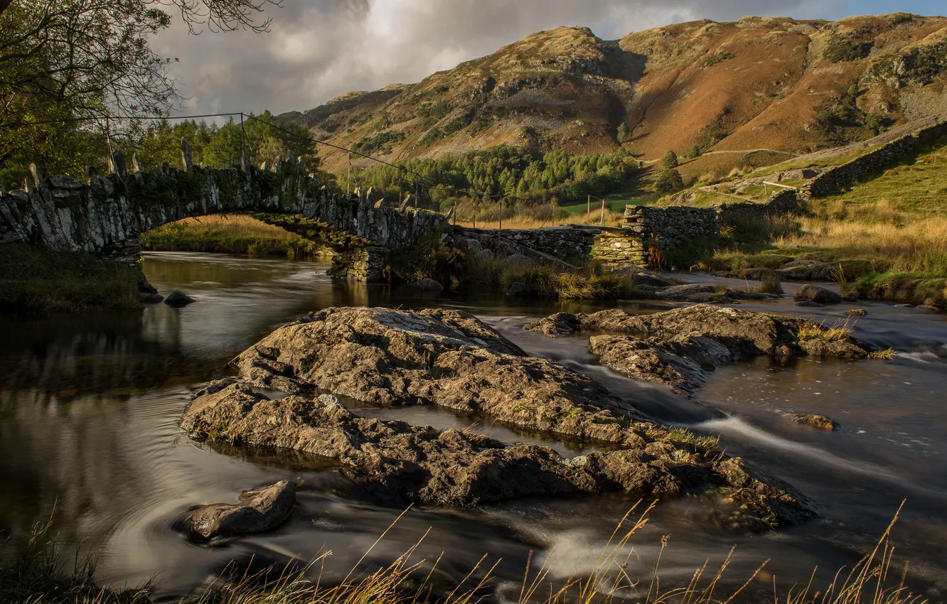 Photo wallpaper the sky, trees, mountains, clouds, bridge, river, stones