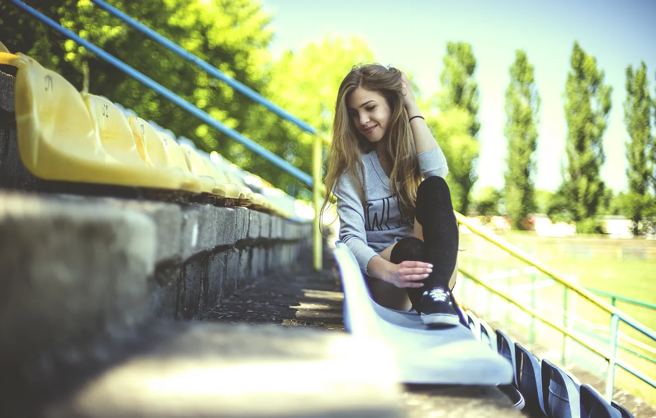 Photo wallpaper girl, sitting, stadium, bokeh