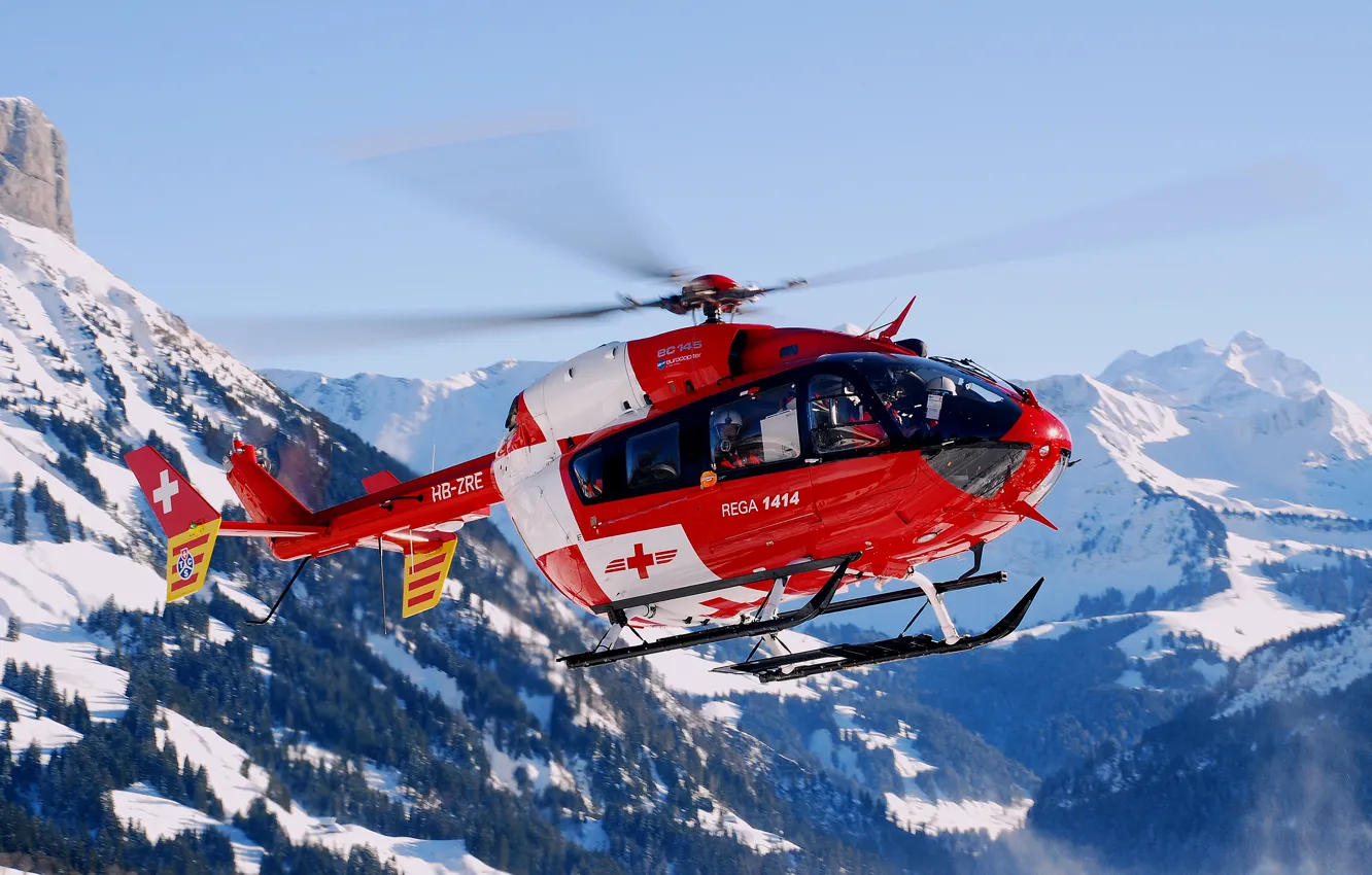 Photo wallpaper forest, flight, mountains, helicopter, flies, in the air, rescue, snow