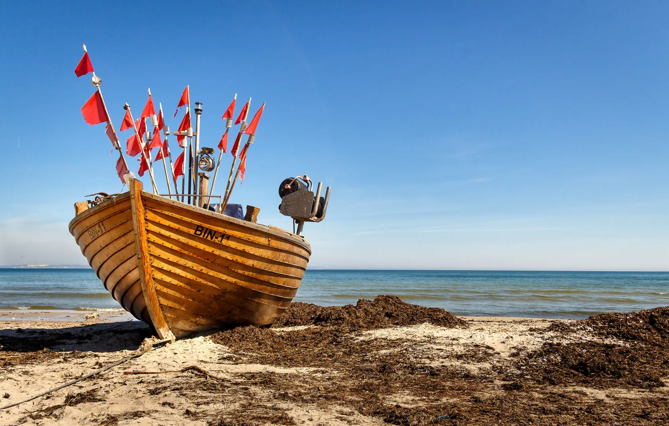 Photo wallpaper coast, boat, flags