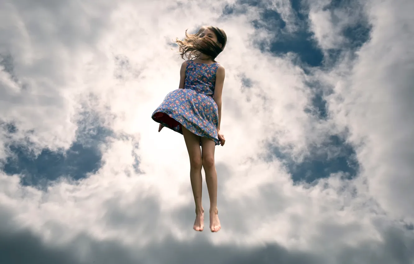 Photo wallpaper the sky, clouds, jump, girl