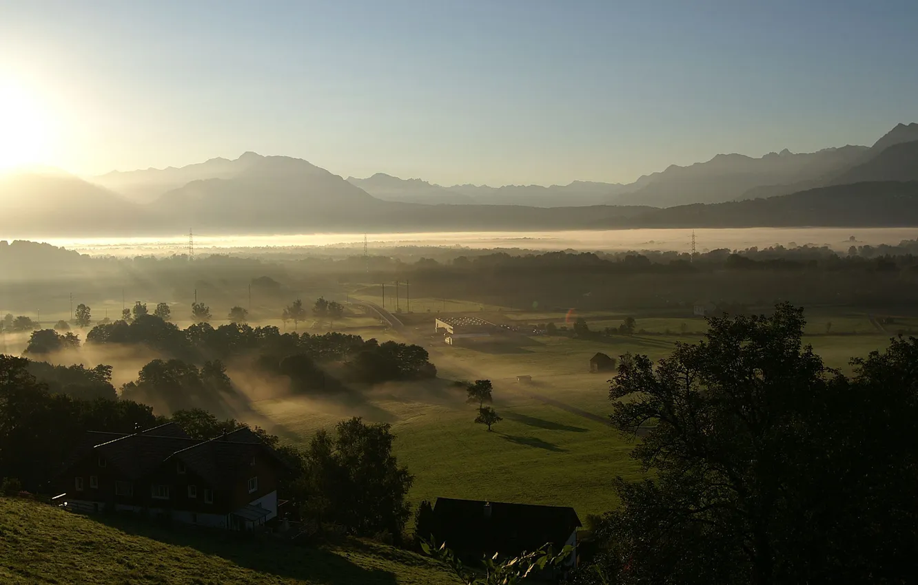 Photo wallpaper rays, mountains, fog, home, valley, haze, sunlight