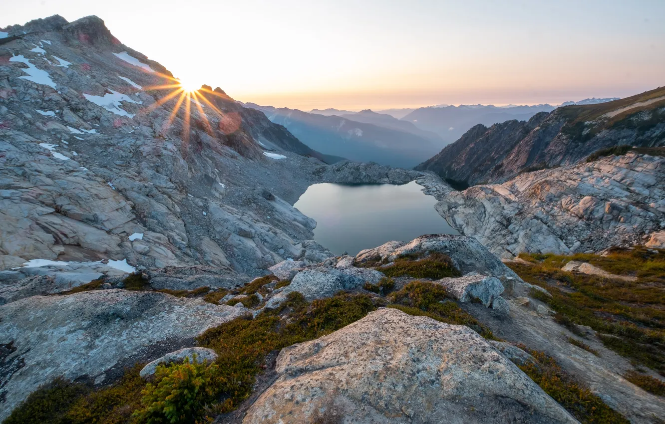 Photo wallpaper the sun, rays, mountains, fog, lake, stones, rocks, dawn