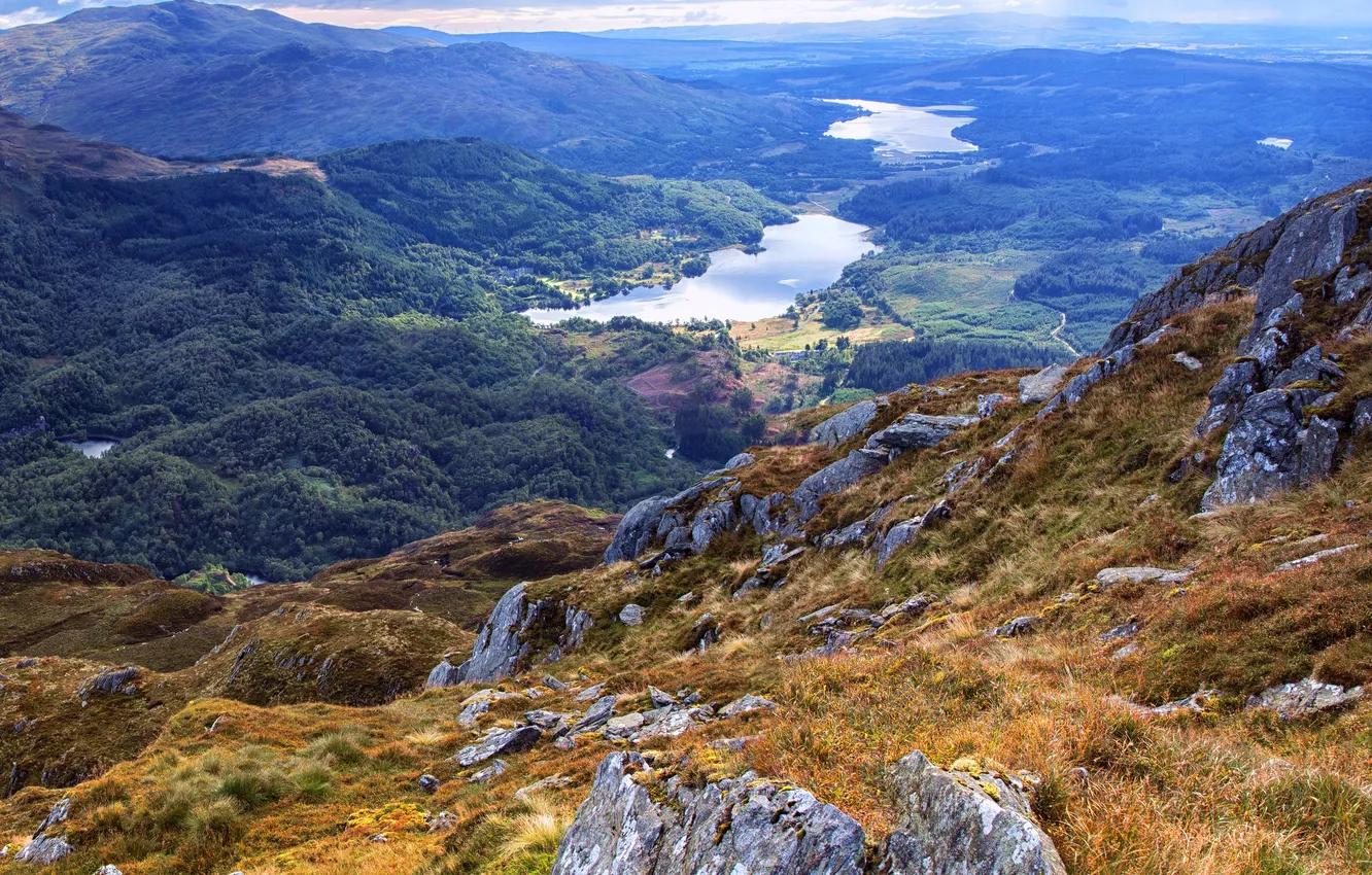 Photo wallpaper field, grass, mountains, lake, stones, slope, Scotland, panorama