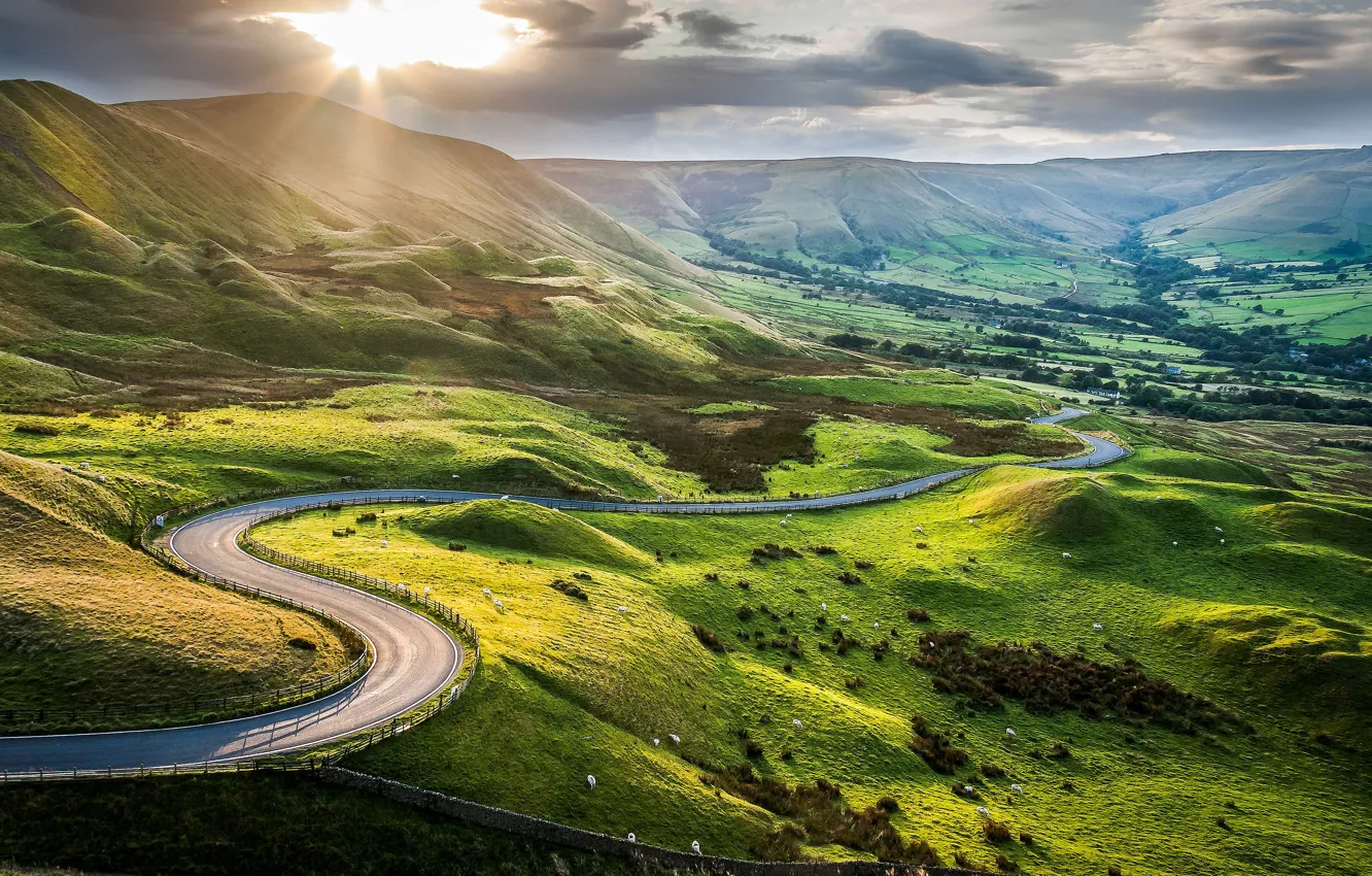 Photo wallpaper road, greens, grass, the sun, hills, pasture