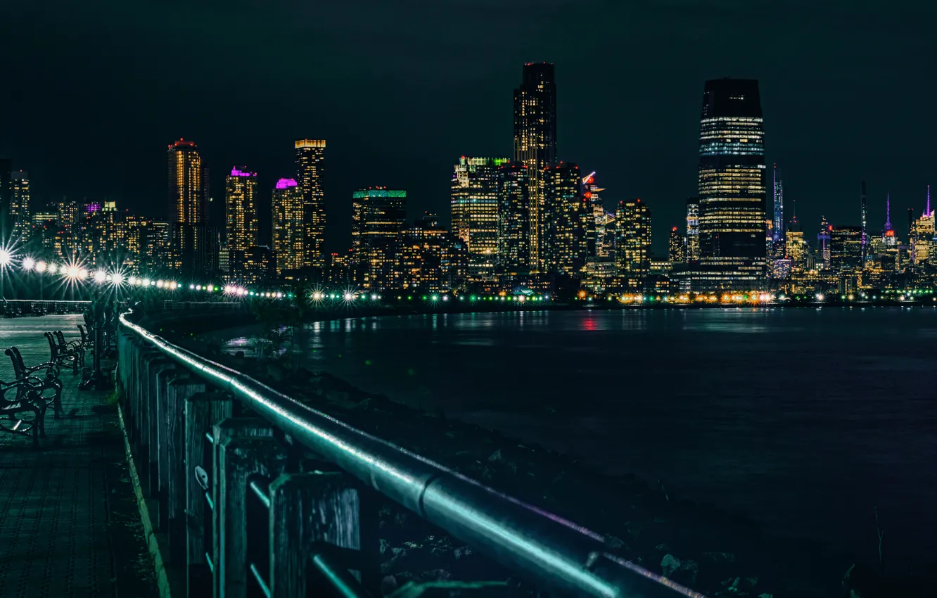 Photo wallpaper night, lights, reflection, shore, building, New York, skyscrapers, the fence