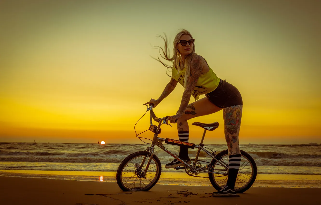 Photo wallpaper sea, beach, girl, sunset, bike, pose, shorts, tattoo