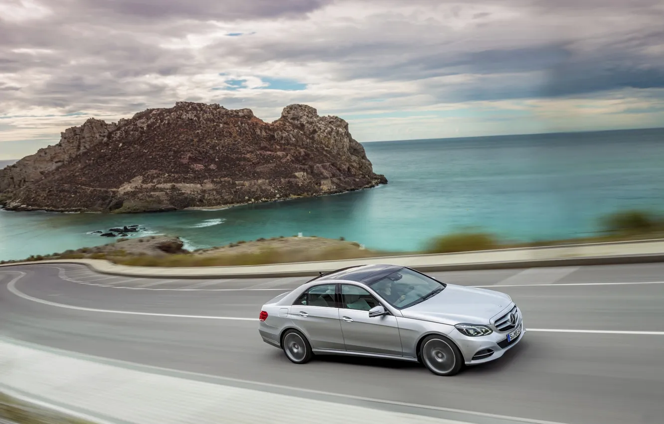 Photo wallpaper road, sea, the sky, clouds, grey, Mercedes-Benz, E-Class, in motion