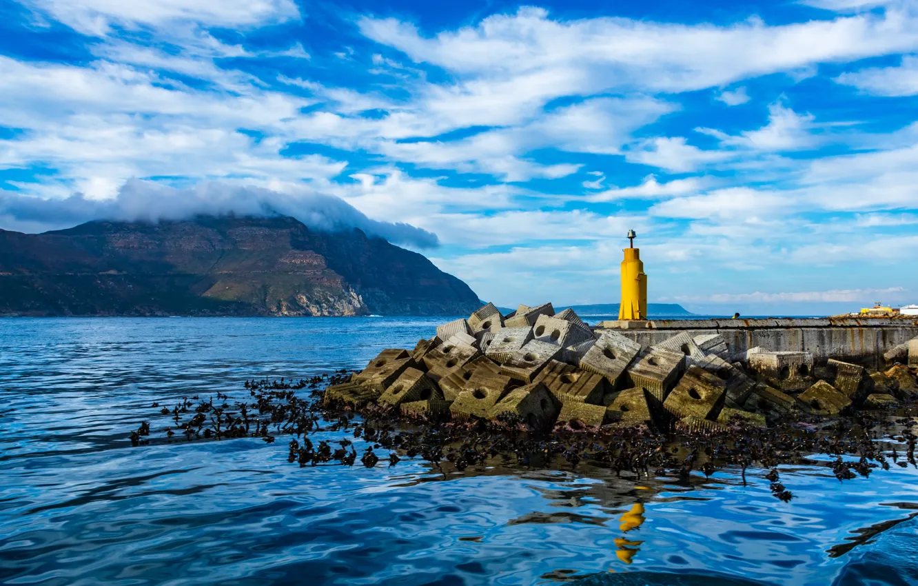 Photo wallpaper sea, water, clouds, mountains, yellow, blue, shore, lighthouse