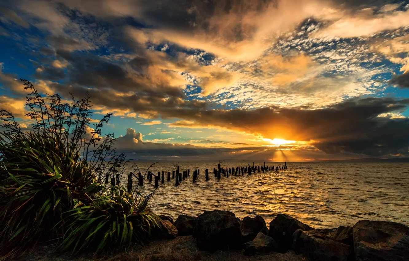 Photo wallpaper sea, the sky, the sun, clouds, sunset, stones, shore, New Zealand