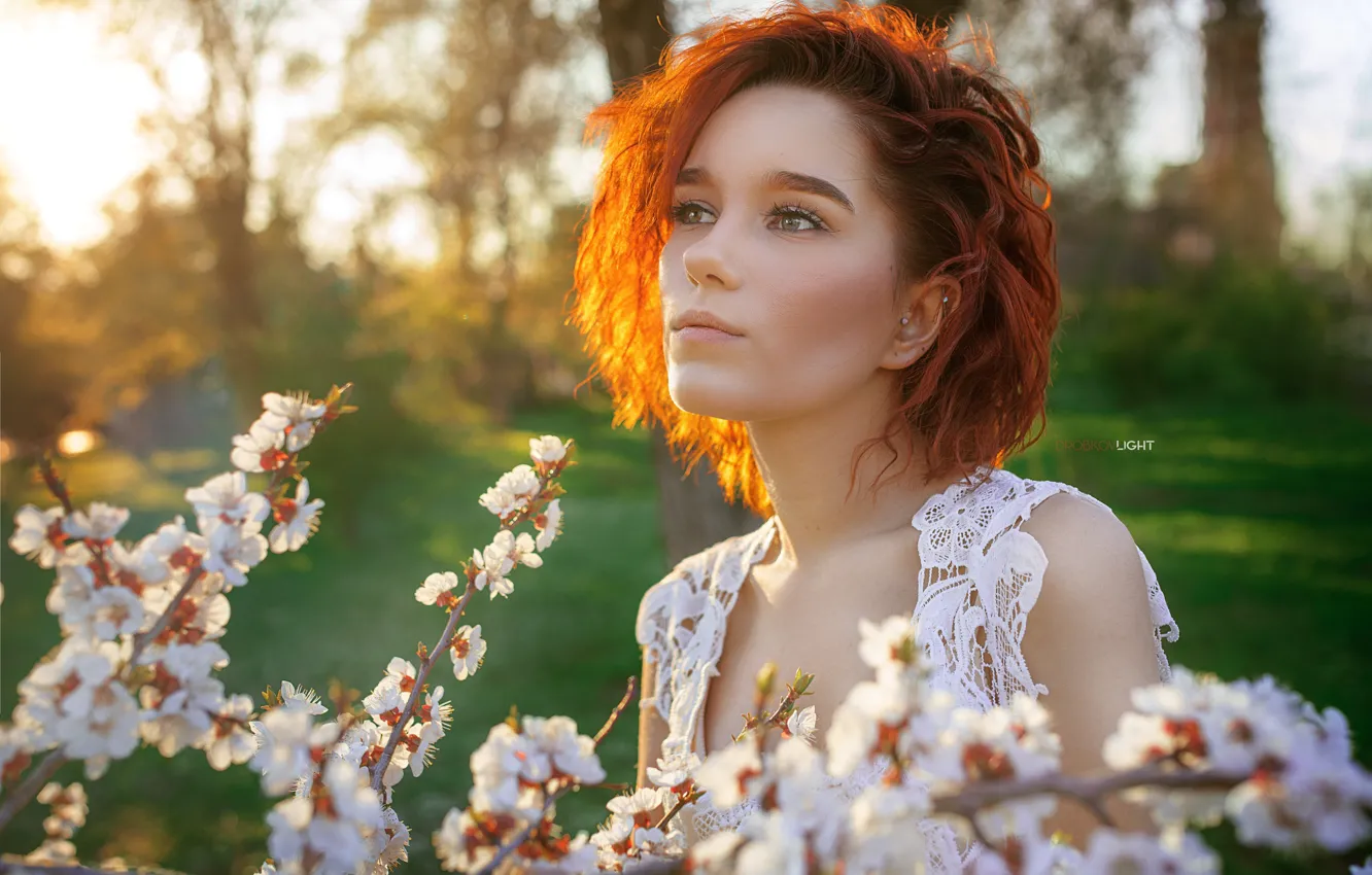 Photo wallpaper girl, branches, face, portrait, spring, red, flowering, redhead