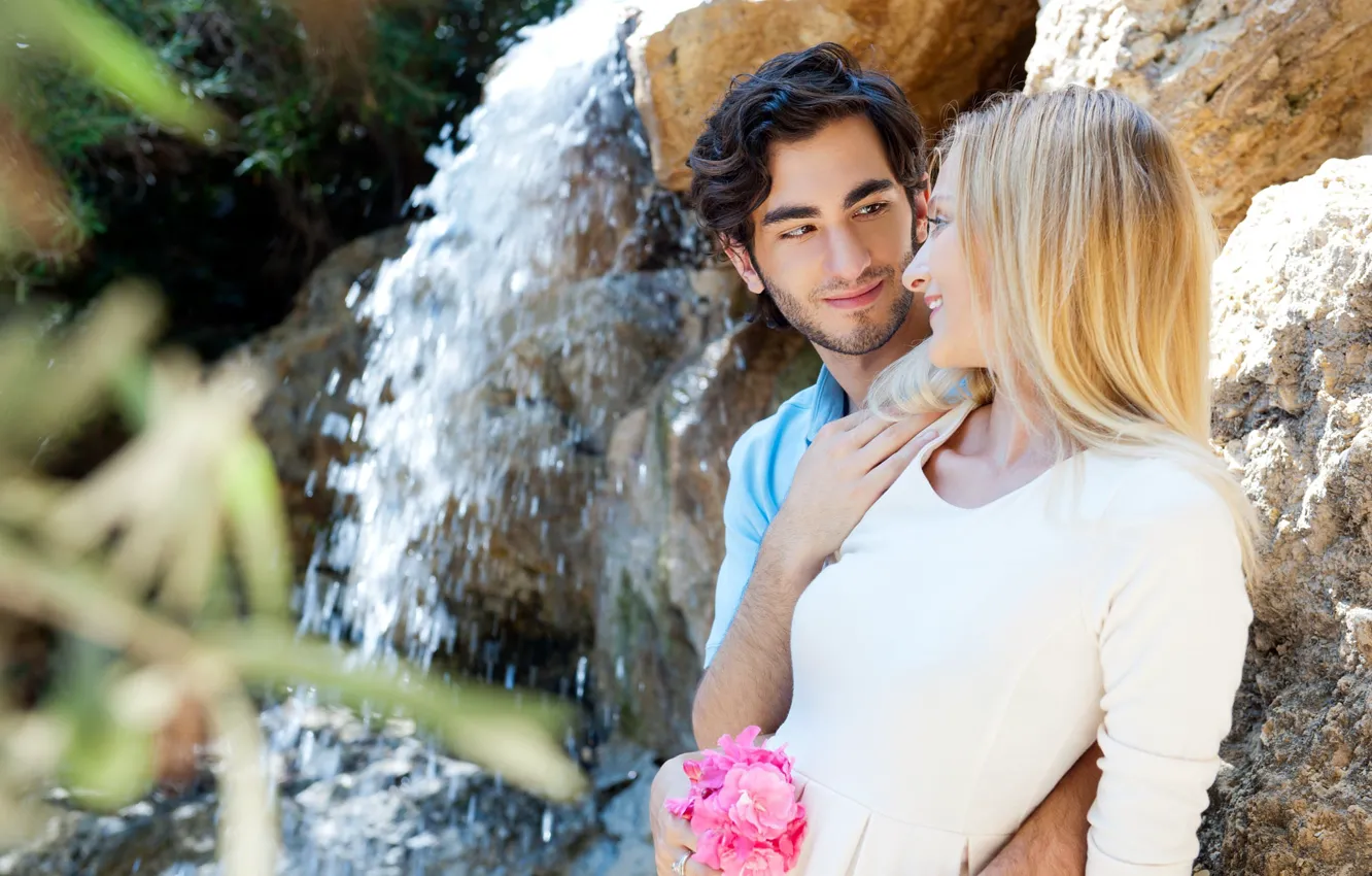 Photo wallpaper girl, love, flowers, stones, waterfall, bouquet, blonde, pair