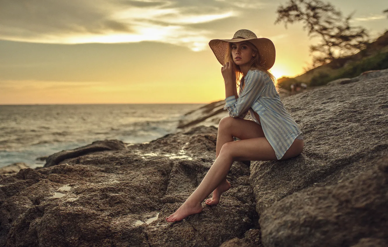 Photo wallpaper sea, the sky, look, sunset, stones, model, hat, figure