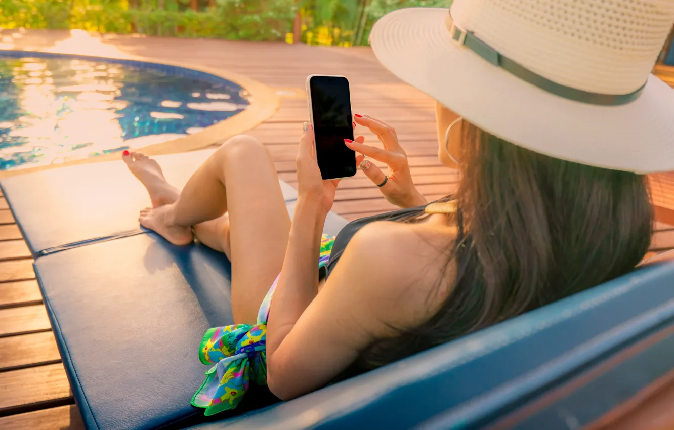 Photo wallpaper beach, summer, girl, hat, pool, sitting, sun loungers, smartphone